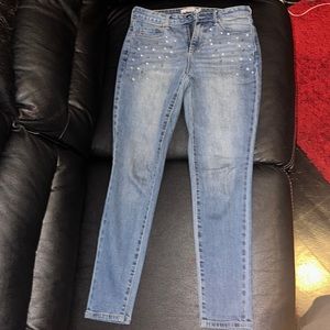 Skinny jeans with white and brown pearl design. Great for casual holiday parties